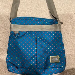 The North Face Blue and Red Polka Dot Messenger Bag